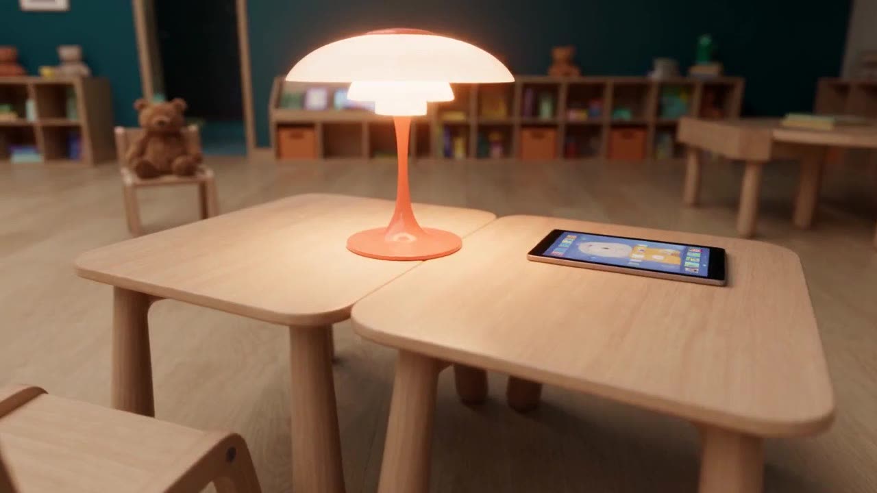 Concept render: a tablet and a lamp on a child-height wooden table in a classroom